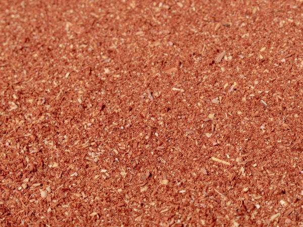 Eastern Red Cedar mulch and shavings, showcasing a rich reddish-brown color and fine texture, ideal for landscaping and gardening applications.