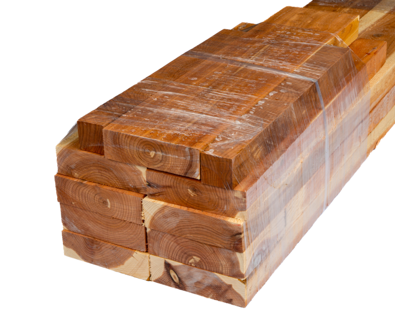 Stack of premium Eastern Red Cedar lumber, wrapped for protection, ideal for crafting raised beds and patio planters.